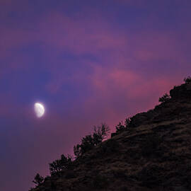 Moonlit Evening Over Silhouetted Hills