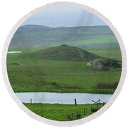 Tranquil Green Hills And Distant Sea Round Beach Towel