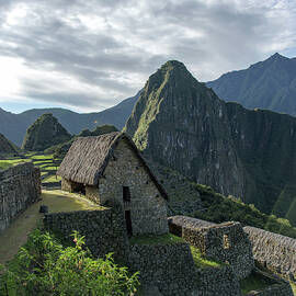 Ancient Ruins with Majestic Mountain Backdrop by Brandon Wichmann