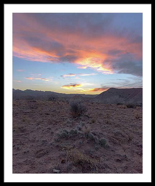 Desert Sunset Over Rugged Terrain Framed Print
