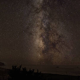 Milky Way Over Tranquil Shoreline by Brandon Wichmann