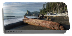 Driftwood on a Pebbled Beach Portable Battery Charger