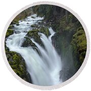 Serene Flow Through Mossy Forest Round Beach Towel