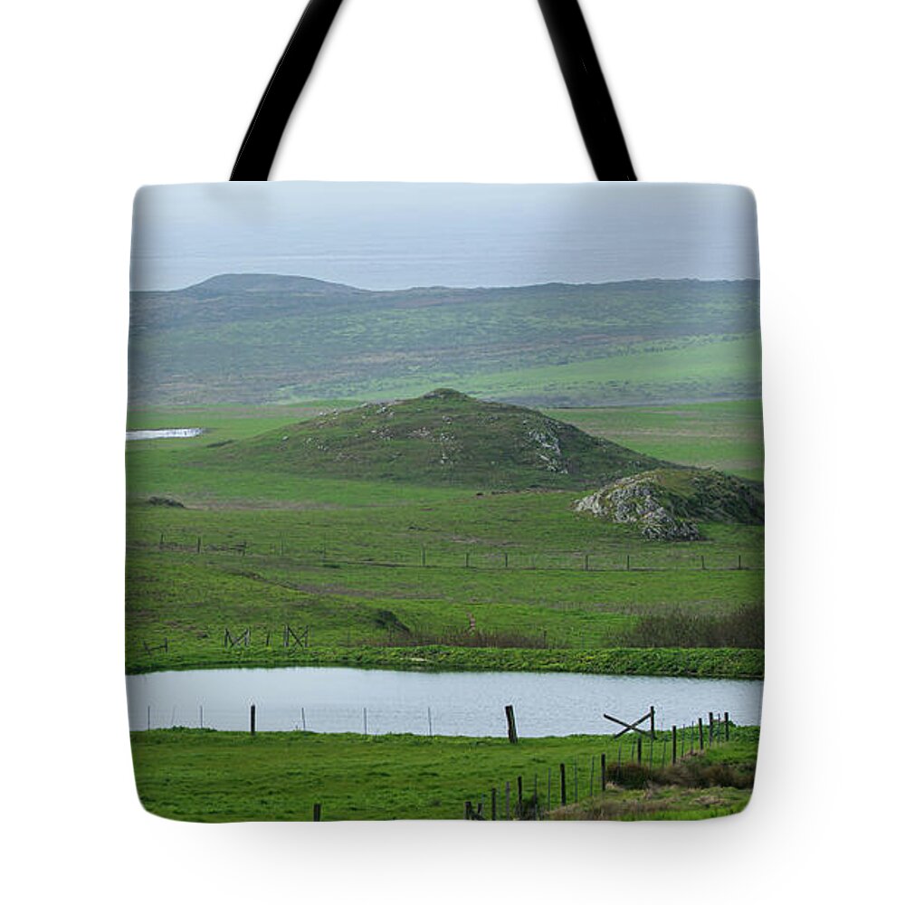 Tranquil Green Hills And Distant Sea Tote Bag
