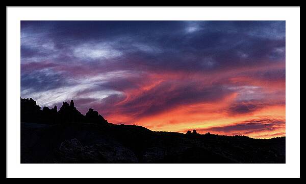 Vivid Twilight over Rocky Silhouette Framed Print