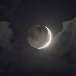 Shimmering Crescent Among Clouds by Brandon Wichmann Shimmering Crescent Among Clouds by Brandon Wichmann
