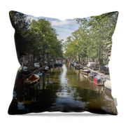 Serene Amsterdam Canal With Boats And Trees Throw Pillow