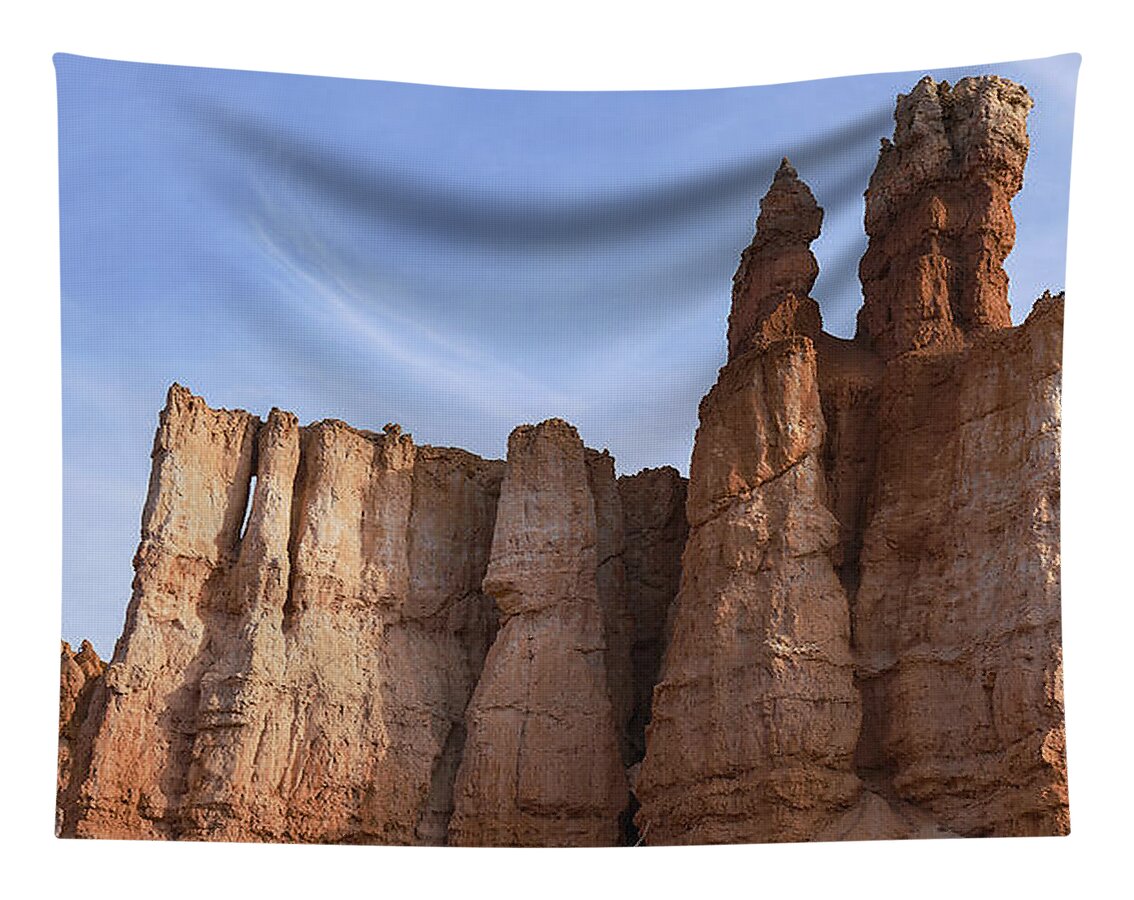 Majestic Rock Formations Under Blue Sky In Bryce Canyon National Park Tapestry