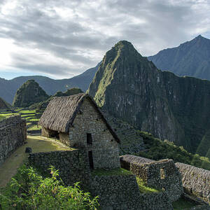 Ancient Ruins with Majestic Mountain Backdrop by Brandon Wichmann
