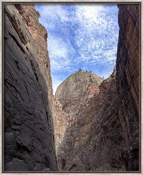 Towering Canyon Cliffs And Blue Sky Framed Print