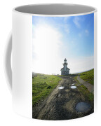 Lighthouse Under A Bright Sky Coffee Mug