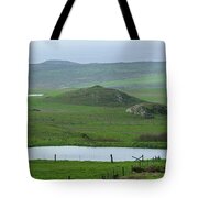 Tranquil Green Hills And Distant Sea Tote Bag
