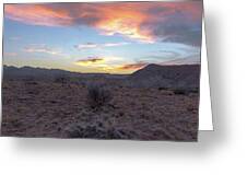 Desert Sunset Over Rugged Terrain Greeting Card