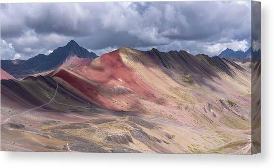 Rainbow Mountain Range under Cloudy Skies Canvas Art Print by Brandon Wichmann