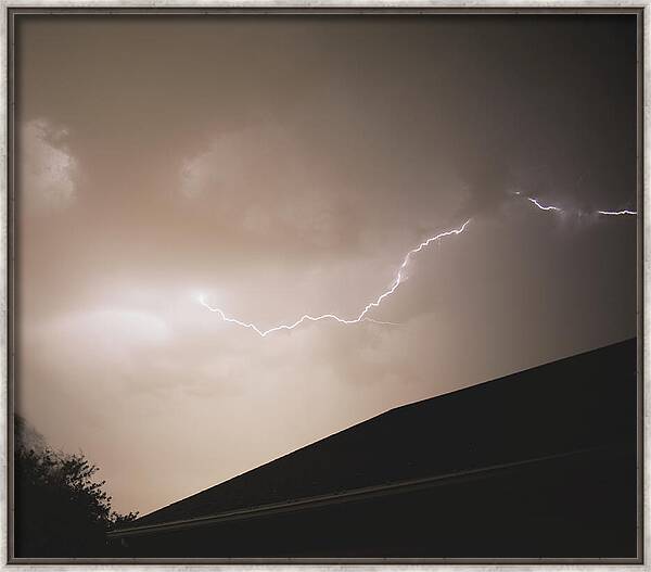 Lightning Illuminates Night Sky Framed Print