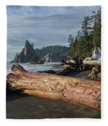 Driftwood on a Pebbled Beach Fleece Blanket