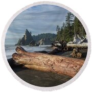 Driftwood on a Pebbled Beach Round Beach Towel