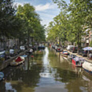 Serene Amsterdam Canal With Boats And Trees Art Print