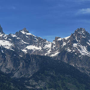 Snow-Capped Teton Mountain Peaks Under Blue Sky by Brandon Wichmann Snow-Capped Teton Mountain Peaks Under Blue Sky by Brandon Wichmann