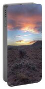 Desert Sunset Over Rugged Terrain Portable Battery Charger