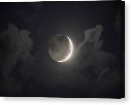 Shimmering Crescent Among Clouds Canvas Art Print by Brandon Wichmann