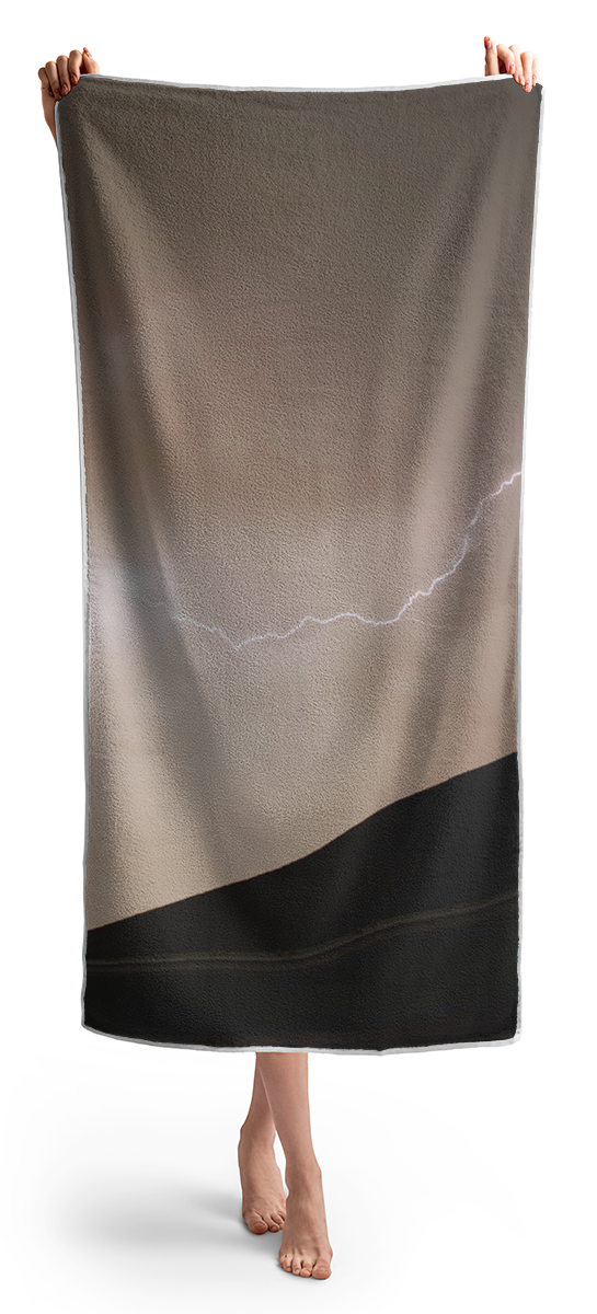 Lightning Illuminates Night Sky Beach Towel