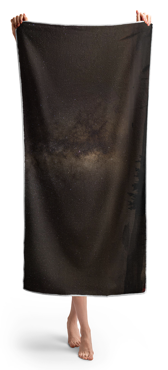 Milky Way Over Tranquil Shoreline Beach Towel
