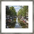 Serene Amsterdam Canal With Boats And Trees Framed Print