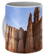 Majestic Rock Formations Under Blue Sky In Bryce Canyon National Park Coffee Mug