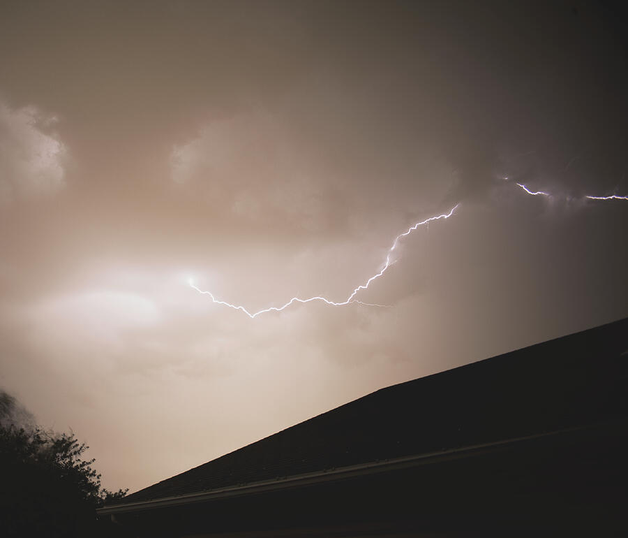 Lightning Illuminates Night Sky Photograph by Brandon Wichmann