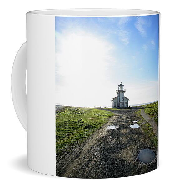 Lighthouse Under A Bright Sky Coffee Mug