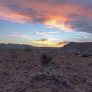 Desert Sunset Over Rugged Terrain Poster