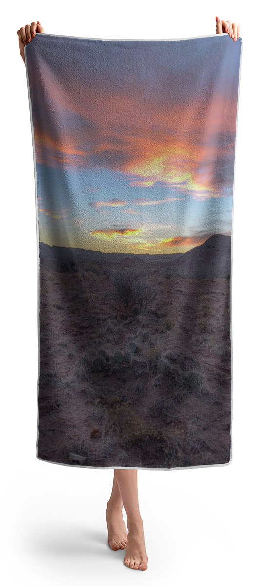 Desert Sunset Over Rugged Terrain Beach Towel