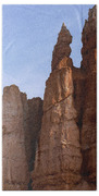 Majestic Rock Formations Under Blue Sky In Bryce Canyon National Park Beach Towel