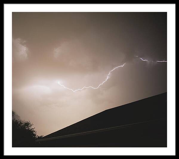 Lightning Illuminates Night Sky Framed Print